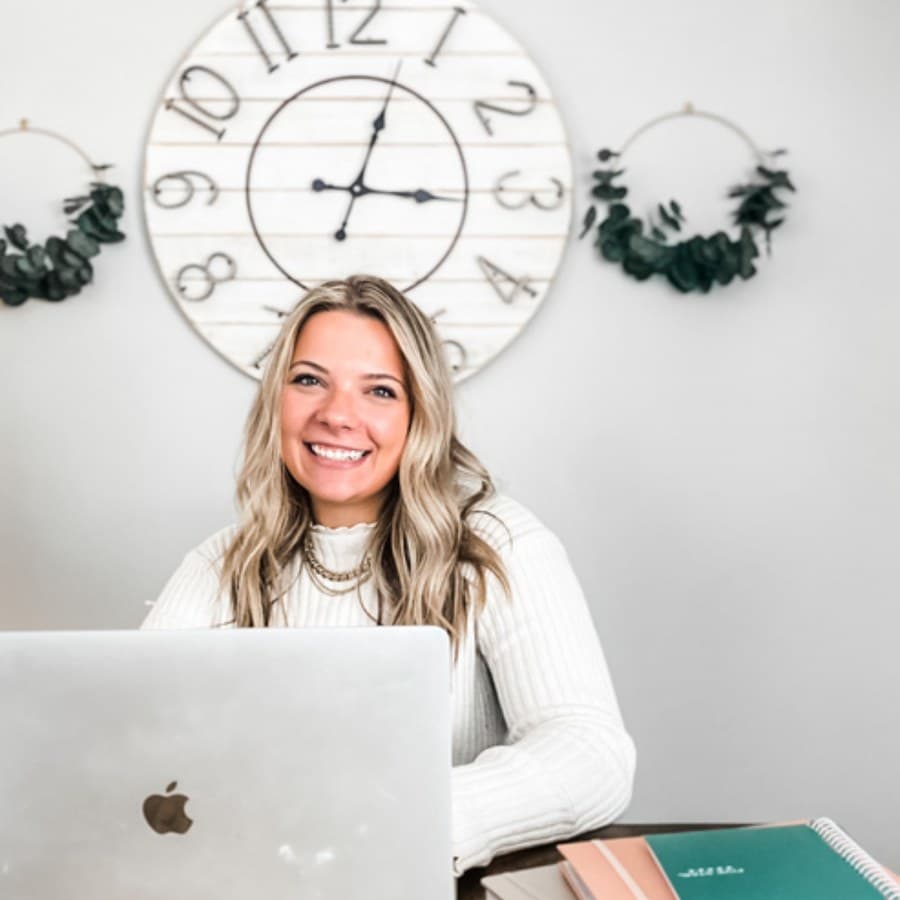 Ashten Tucker, founder of First Keys, smiling at her desk